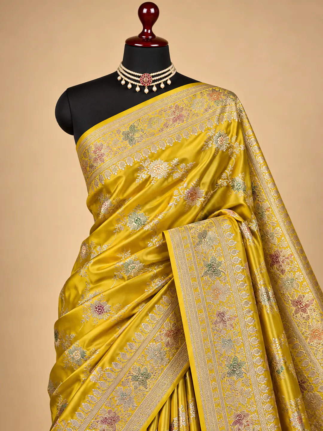 Yellow Mashru silk Banarasi saree with floral booti motifs and contrasting orange-toned floral border - Katan Banaras