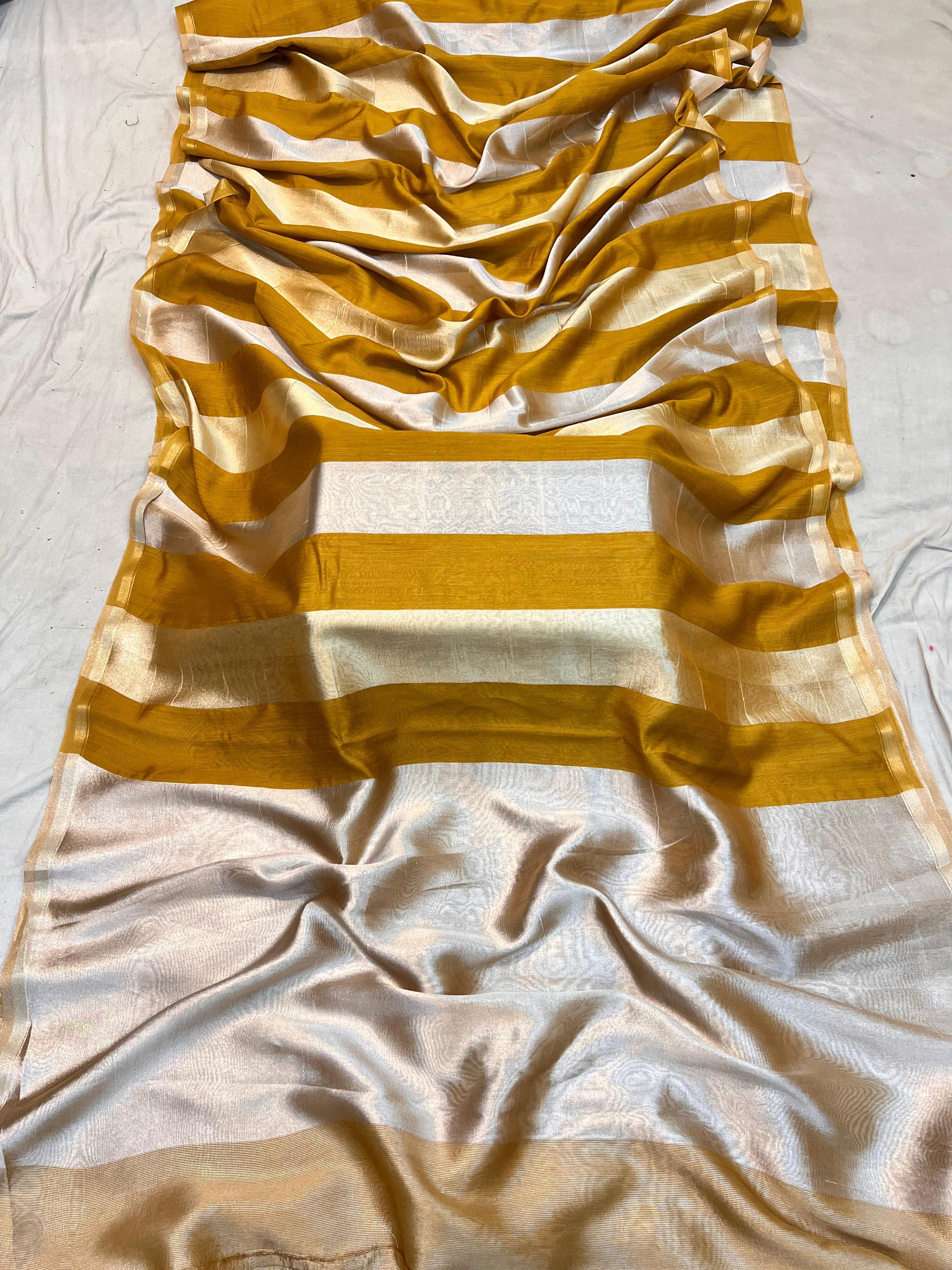Handwoven Moonga Silk Banarasi Saree available in multiple colors including black, red, and parrot green