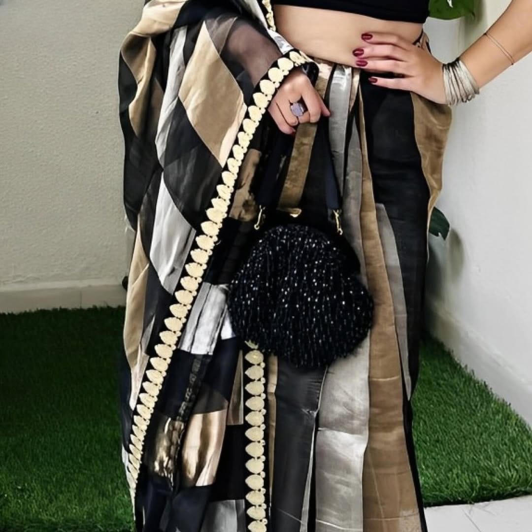 Authentic Banarasi silk saree with zari border, crafted by artisans in Varanasi.